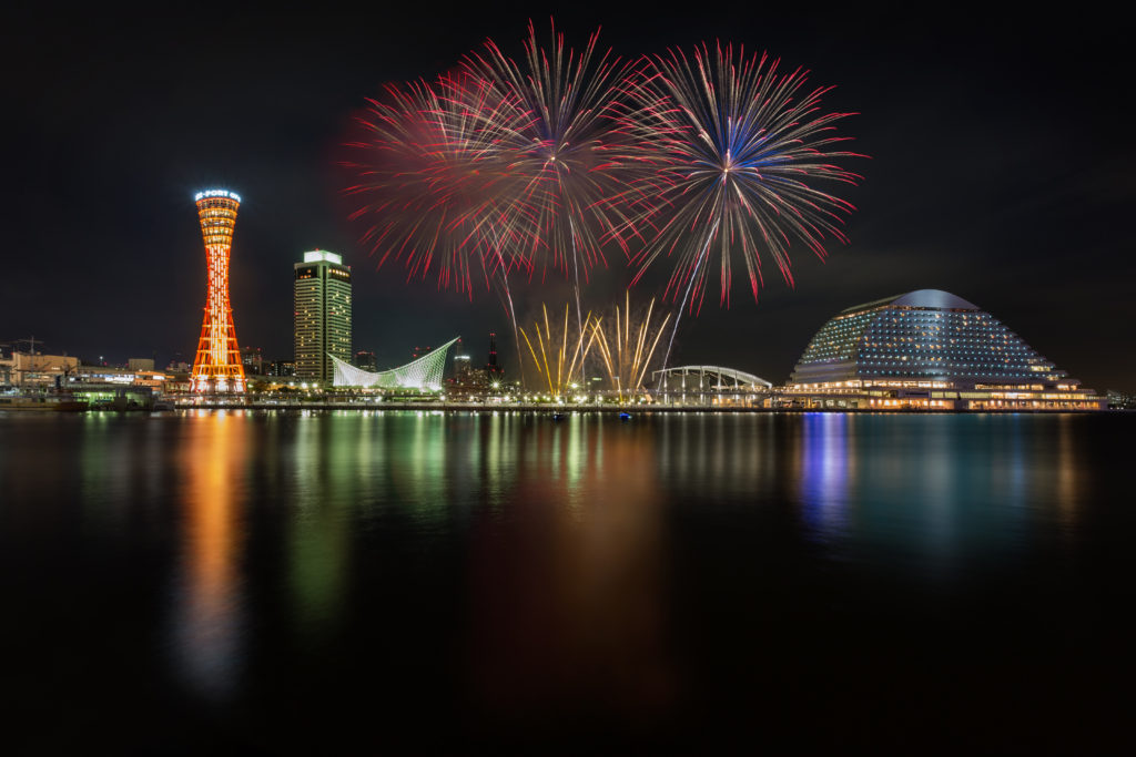 Fireworks celebrating over kobe port at night, osaka japan